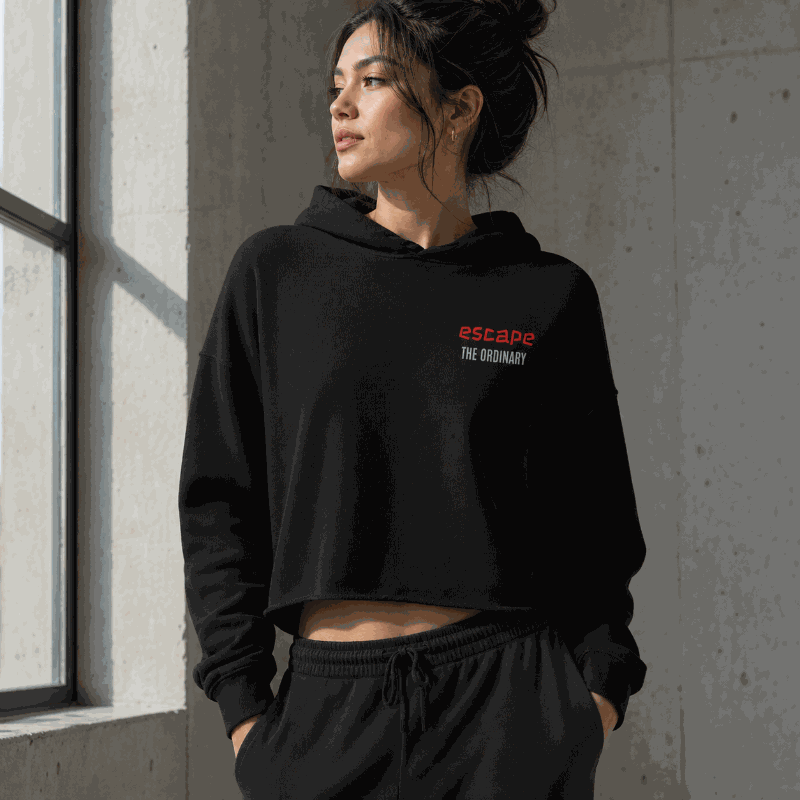Escape The Ordinary crop hoodie with raw hem and dyed drawstrings in streetwear style